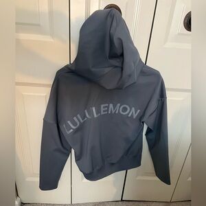 blue/gray lululemon zip up with big logo